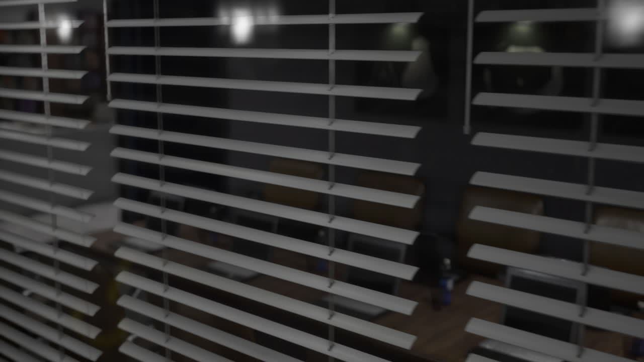 Looking through blinds at a quiet modern space in the evening light