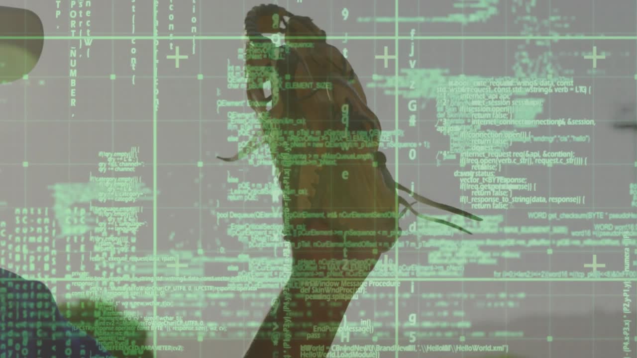 Man lifting rotating glove, starting motion while IT code grid overlay covers frame, readying catch