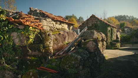 traditional street with abandoned stone houses in a portuguese countryside village