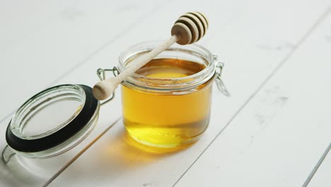 jar of honey with spindle