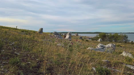 Stunning Swedish landscape with Rauk limestone formations in Gotland at dusk, pan right