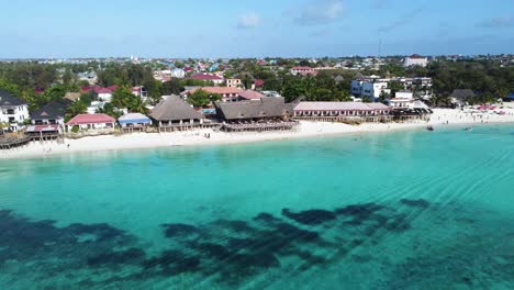 a drone shot of the coral reef of nungwi beach on the tropical island of zanzibar in tanzania in africa
