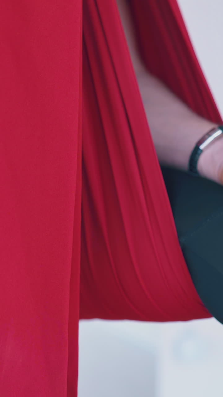 man holds hands on knees in gyan mudra meditating position and relaxes after fly yoga workout extreme close view