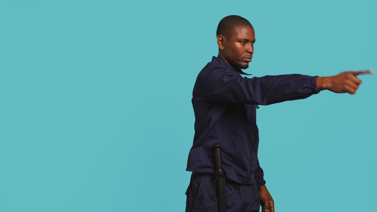 Portrait of stern bodyguard pushing back unwanted visitors