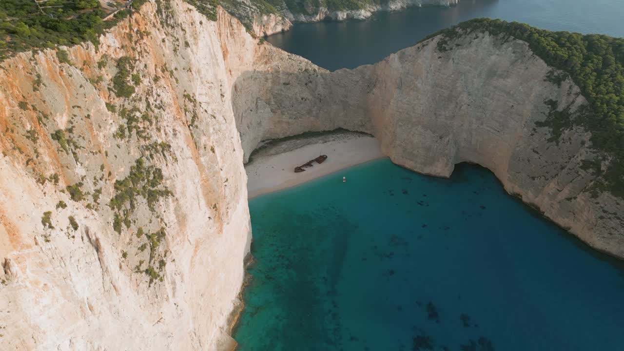 The shipwreck beach in zante, greece, showcasing turquoise waters and cliffs, aerial view