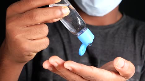 applying hand sanitizer