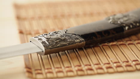 japanese sword, zen environment, quick camera slide, warm light