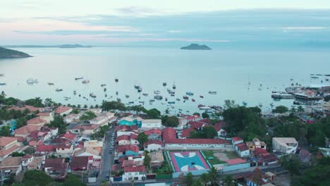 Establishing-shot-of-Praia-do-Canto-during-the-sunrise,-picturesque-coastal-village-in-Búzios