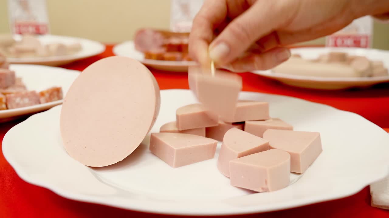 Preparing sliced sausage appetizers