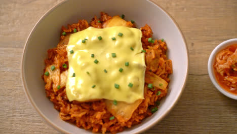 kimchi fried rice with pork and topped cheese - asian and fusion food style