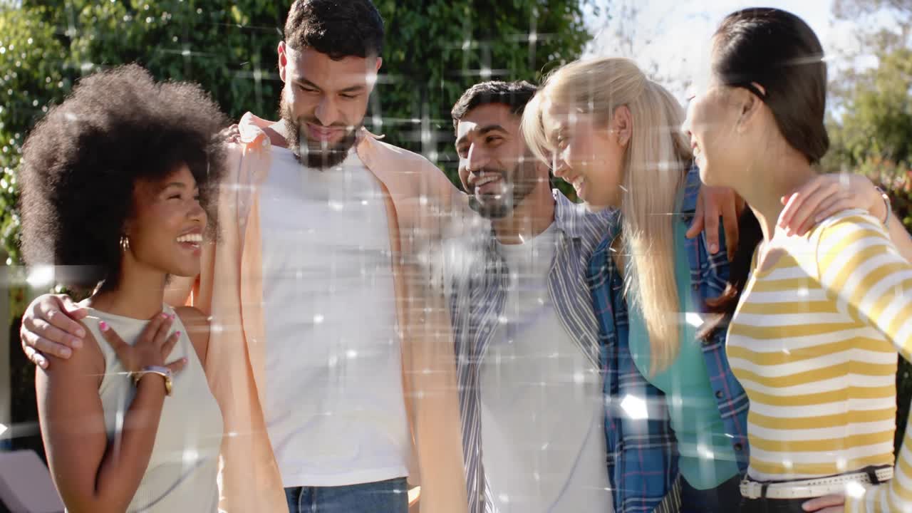 Social ad with five friends, woman at left pointing and causing sparkling grid, group laughing