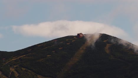 Clouds-billow-past-scenic-summer-ski-lift-rides-in-New-Hampshire,-time-lapse