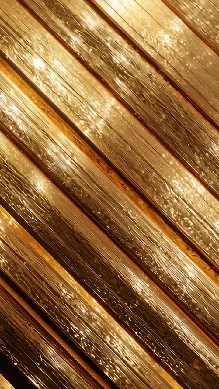 Vertical video: Shot showing sunlight reflecting on wet angled wooden deck boards with water film