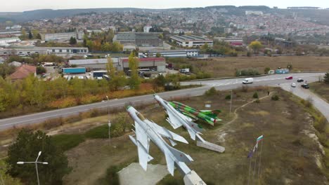 aerial panning footage of military airplanes outdoor museum exhibition-4