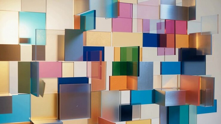 Shifting camera moving closer to hanging colored block art in gallery, revealing color depth