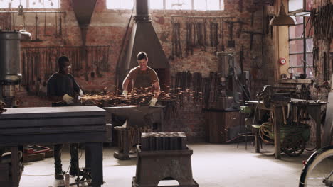 blacksmiths at work in a workshop