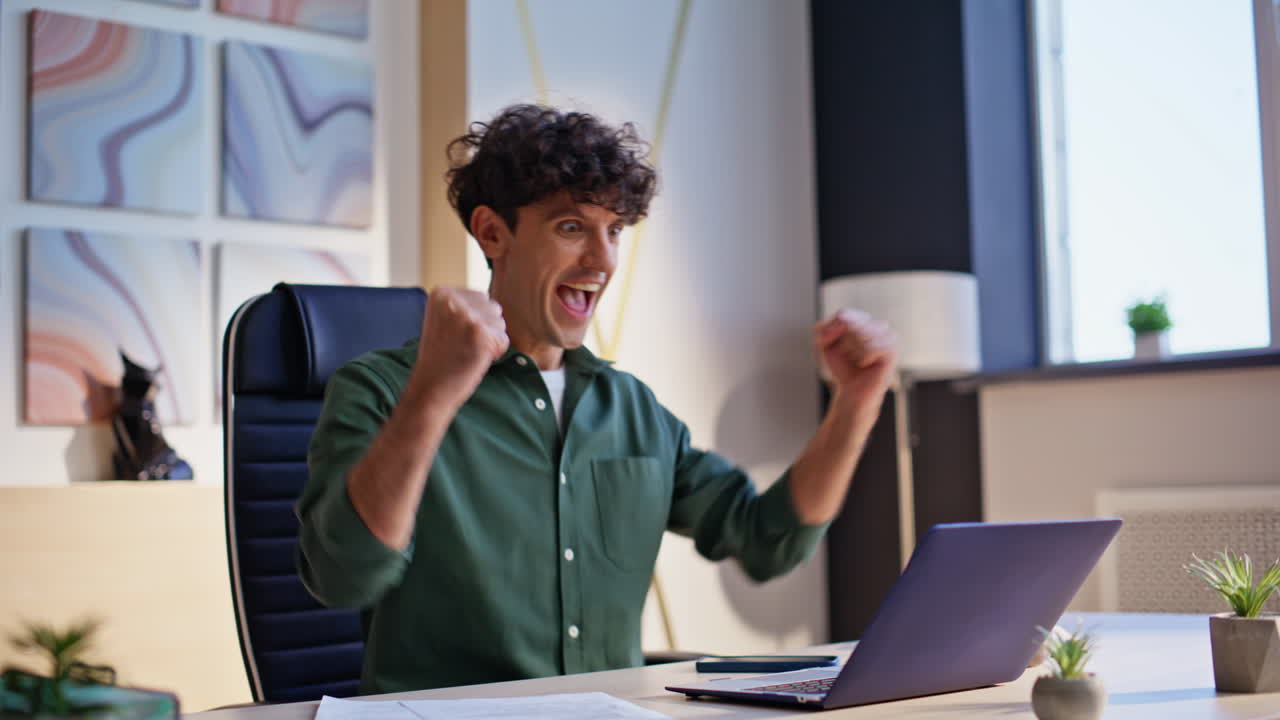Company worker examining paperwork inputting data in laptop at workplace closeup