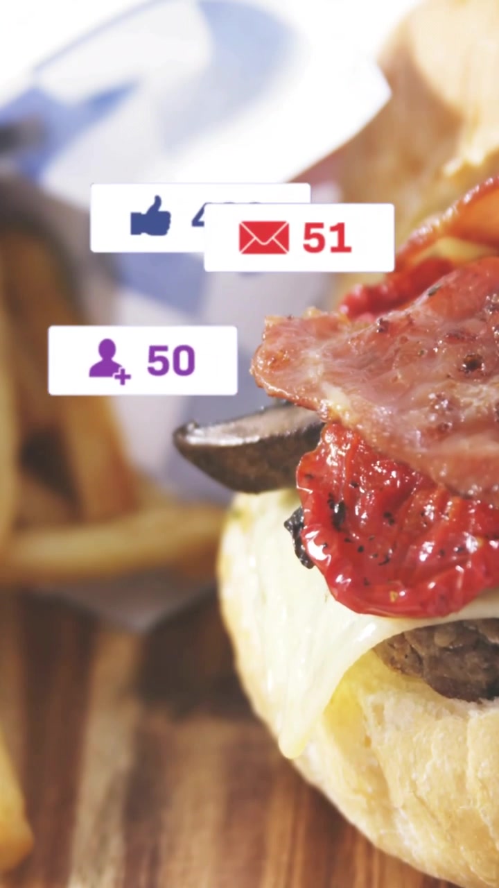 Video verticale: Cursore in movimento, un hamburger riceve badge pulsanti, i conteggi aumentano, svanendo per mostrare il fermento.