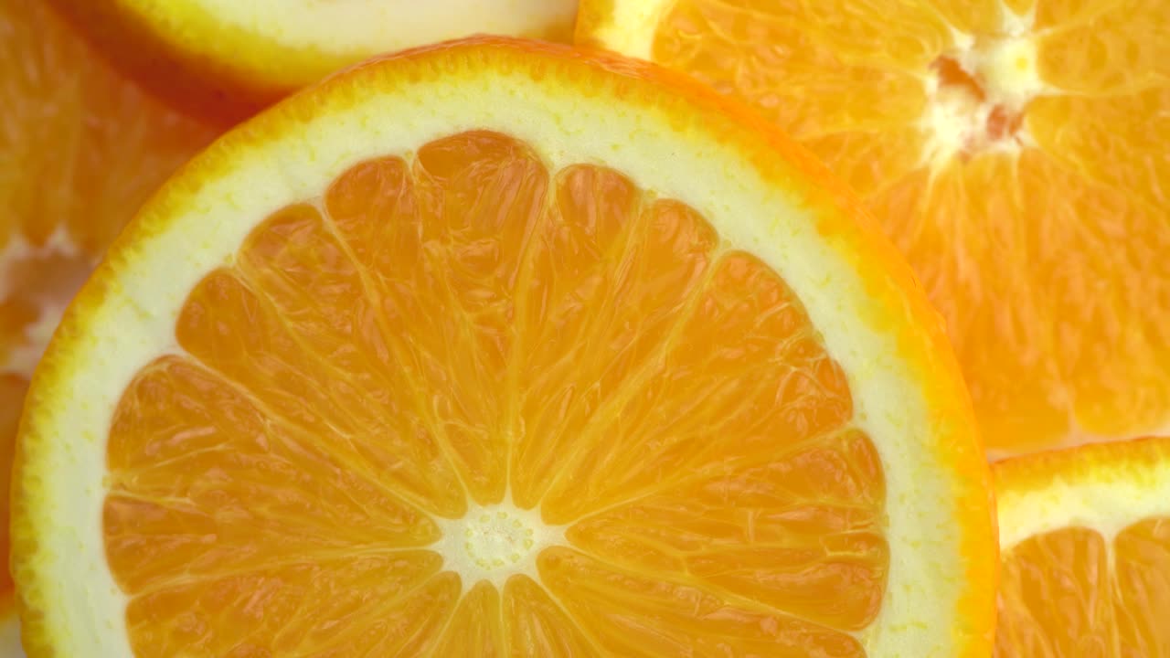macro rotación de video de rodaja de frutas de naranja.cerrar la carne de la naranja.