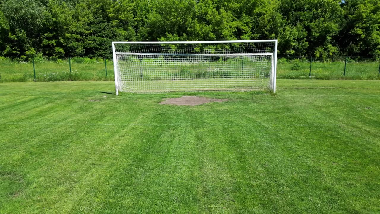 Aerial Top View of Green Soccer Field Landscape