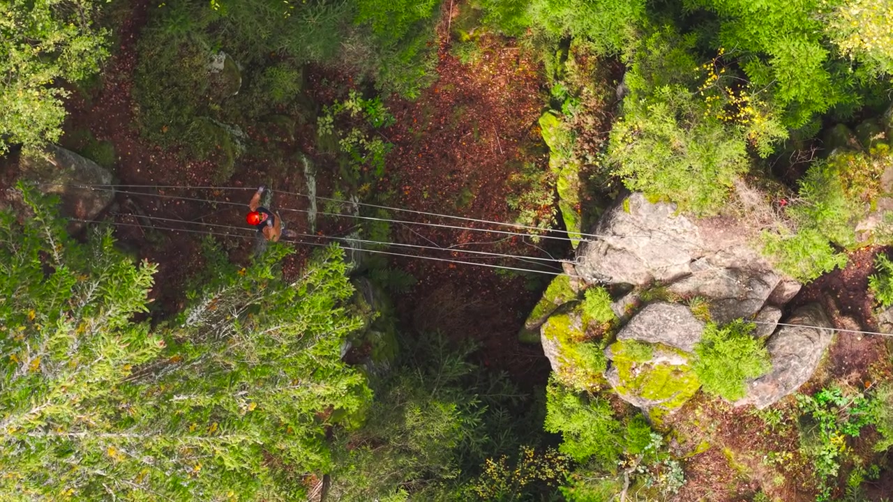 Aerial top down - mountain climber wave hand and call for help, Czechia