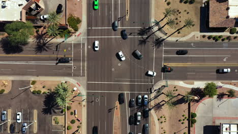 Birds-eye-drone-shot-above-traffic-on-the-streets-of-sunny-Ahwatukee,-AZ,-USA