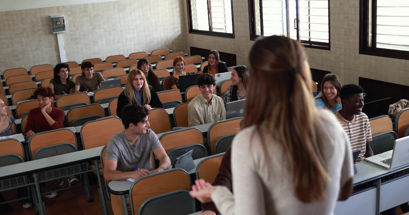 Teacher Giving a Lecture to Students in a University Classroom