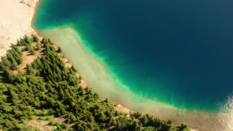 Aerial-Top-Down-Rotation-of-Green-Blue-Water-at-Carnarvon-Lake,-Kananaskis,-Alberta,-Canada