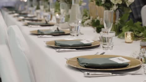 elegant wedding dining table silverware arrangement on a long horizontal table