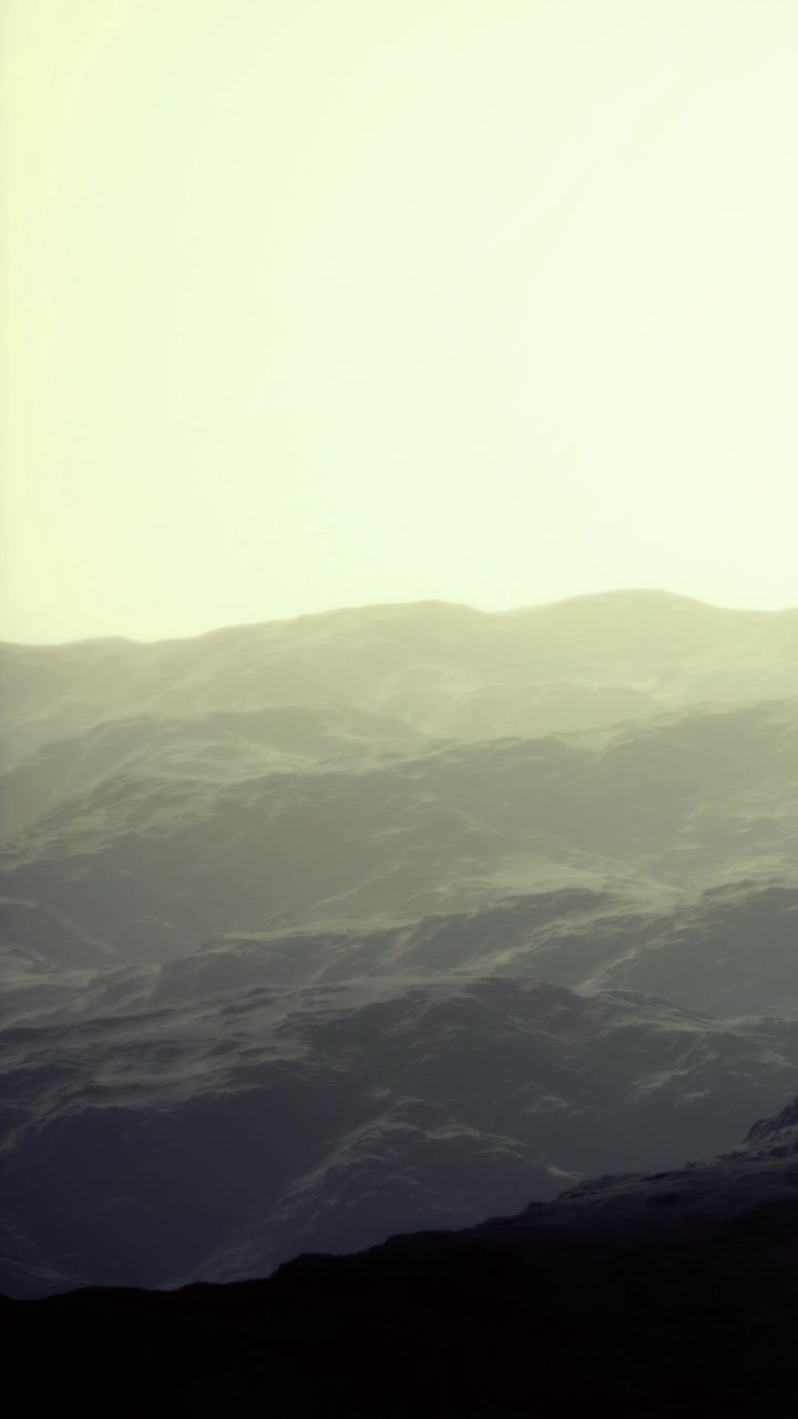 Waves move gently under soft light in a distant sea at twilight hour
