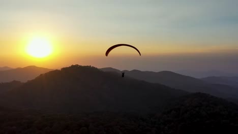 paragliding by the sun and the mountains