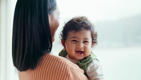 mother, newborn and smile by window