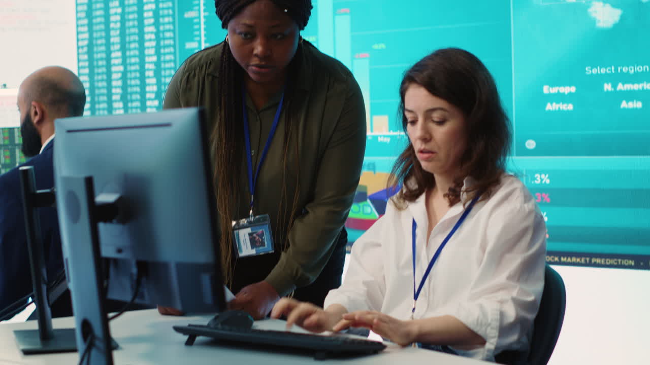 Business associates comparing key performance indicators within the firm