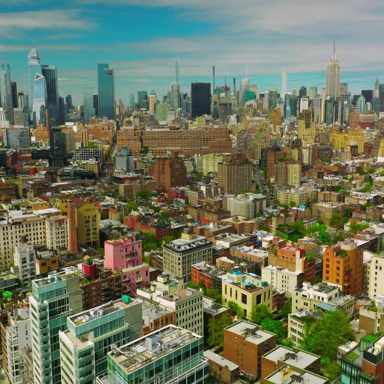 Sunny New York quarters with diverse architecture. Aerial view of metropolis with skyscrapers at backdrop
