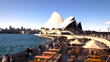 sydney opera house and waterfront promenade with crowds