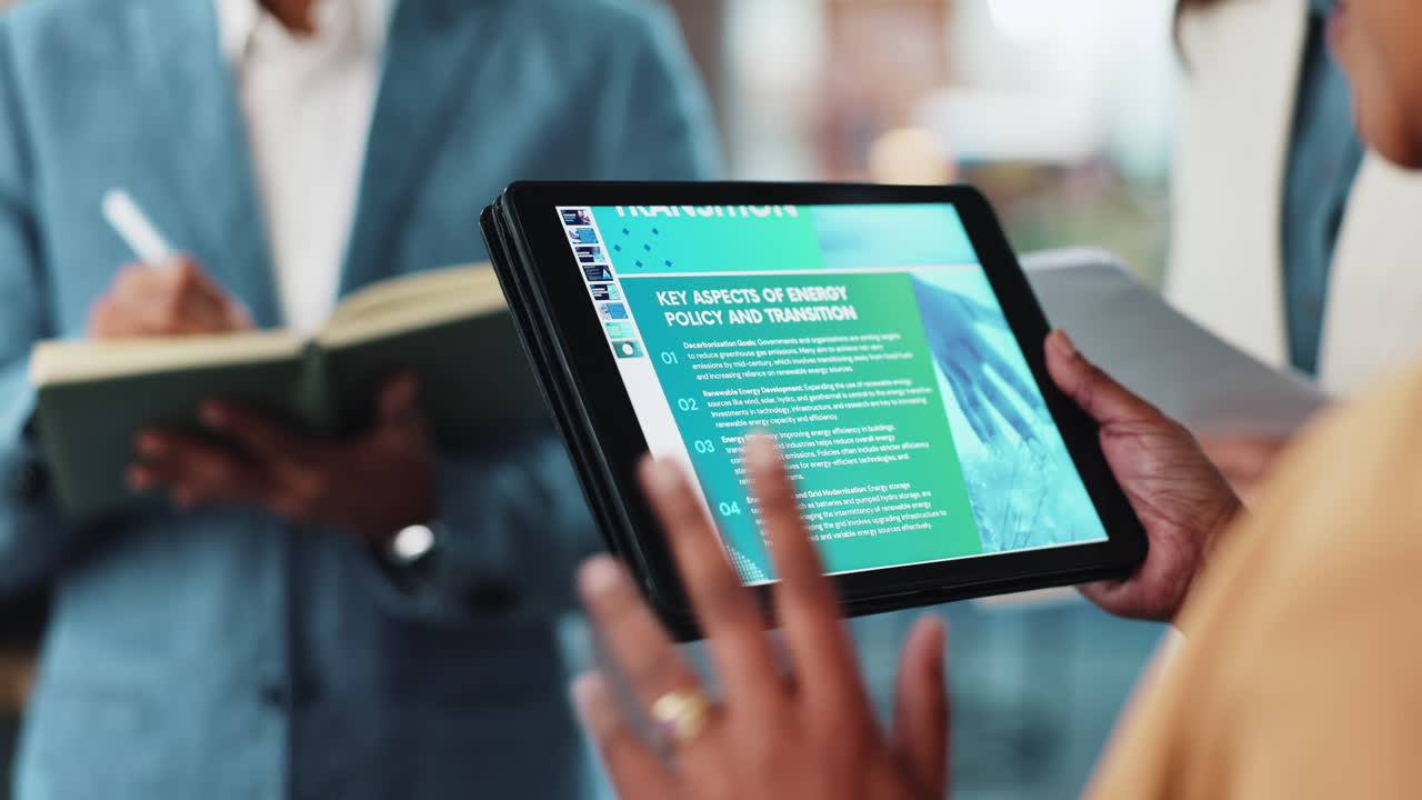 Business Meeting with Energy Transition Presentation on Tablet