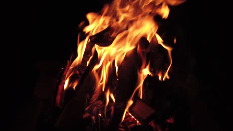 a burning log fire in the night, slow motion capture