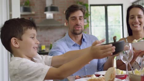 family having meal together on dinning table at home 4k