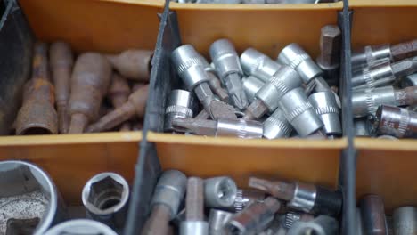 assortment of tools in a storage box