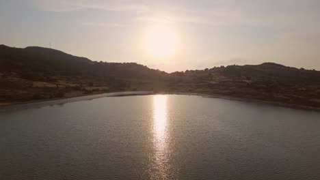 Aerial:-Manmade-lake-with-a-farm-with-sheep-on-Lesbos,-Greece