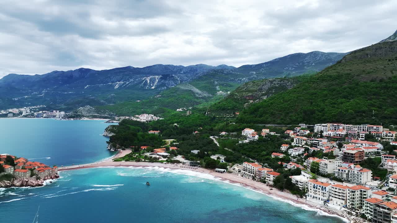 Panning left from the coastline past Aman Sveti Stefan luxury resort Montenegro