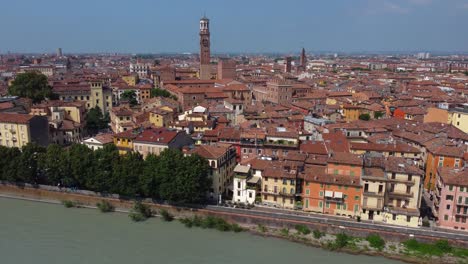 cinematic drone video of city of verona from above with adige river and torre dei lamberti - verona, italy