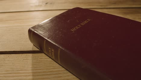 religious concept shot of old bible on wooden table 2