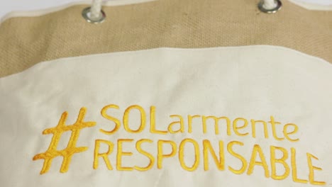 sun protection hashtag on beige tote bag, close up