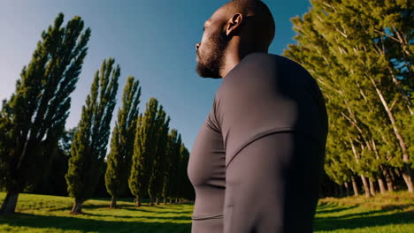 man in a field of trees