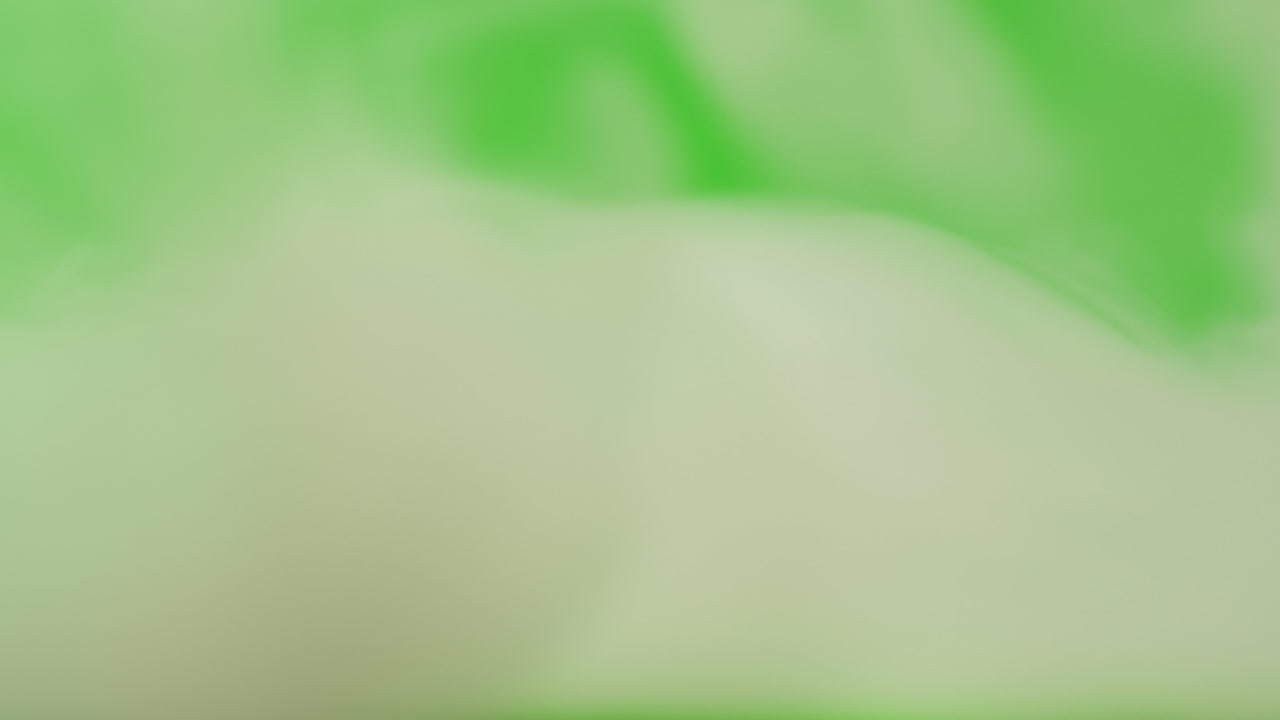 White Smoke Against Green Screen