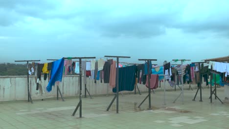 clothes hanging outside on a roof top to dry