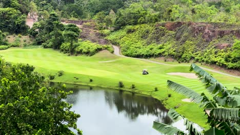 lush green golf course landscape with water feature in phuket