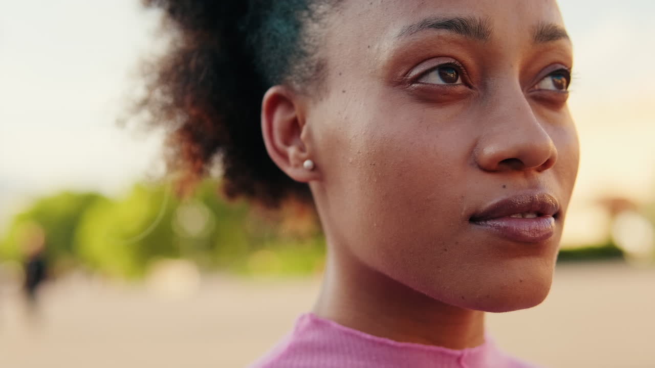 Young Black Woman Smiles in the Park