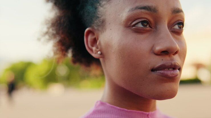 Young Black Woman Smiles in the Park